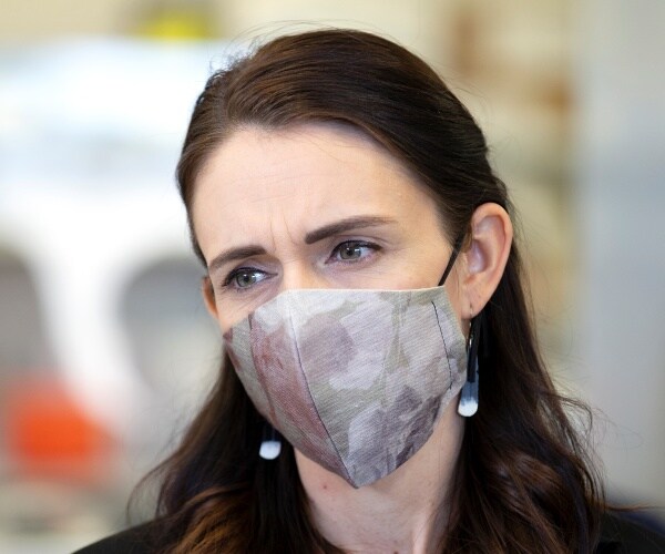 ardern in a silver mask
