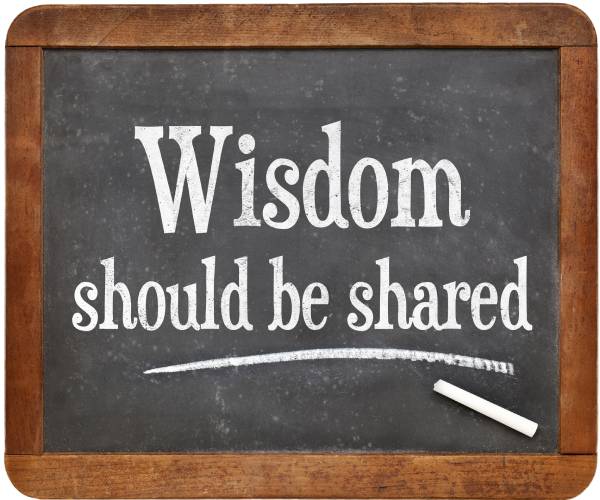 the words wisdom should be shared written on a chalkboard