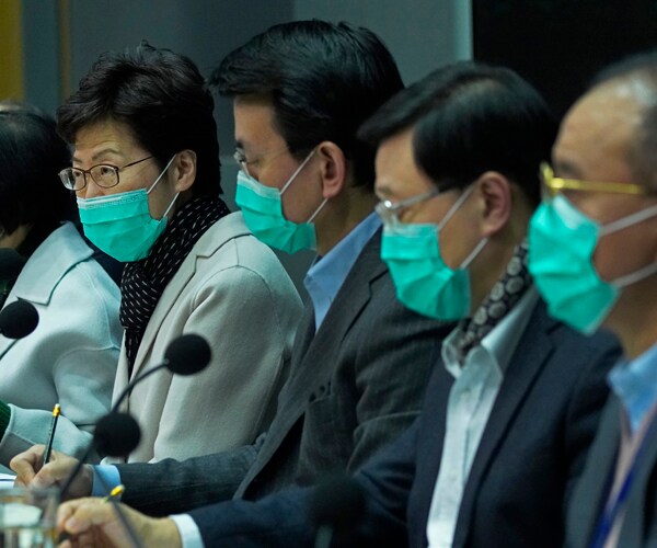 hong kong leader carrie lam and other officials announce travel restrictions to and from mainland china