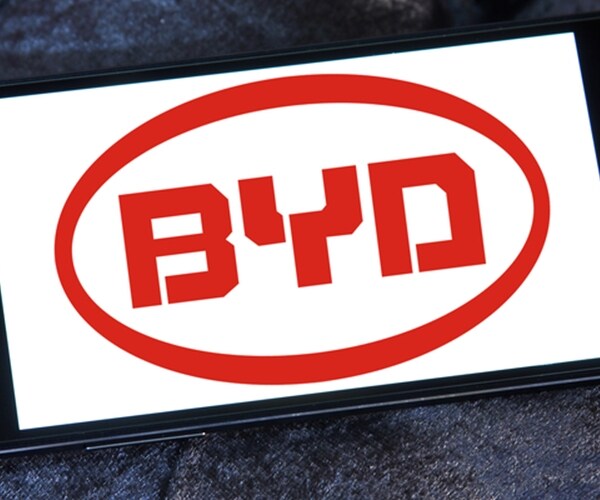 Logo of chinese byd car brand in red print on screen of black samsung mobile