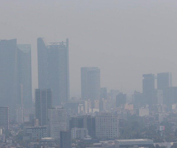 Smog hangs over Mexico City.
