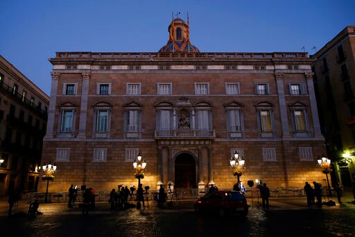 The Latest: Ousted Catalan Official Shows up for Work