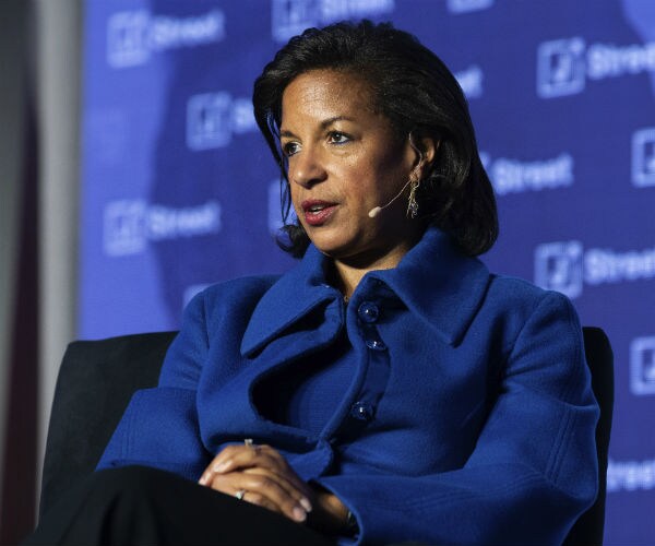 susan rice is shown in a blue suit speaking on stage at a conference in washington, d.c.