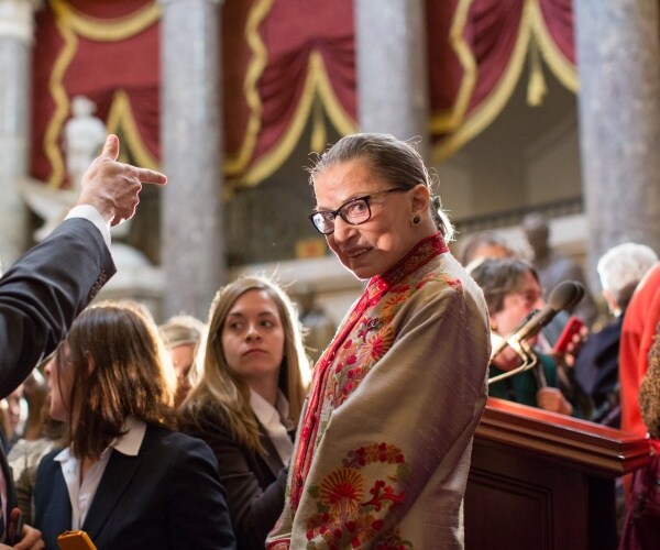 Ruth Bader Ginsburg standing in a crowd