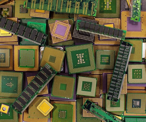 pile of old cpu chips, obsolete computer processors and memory modules. 

