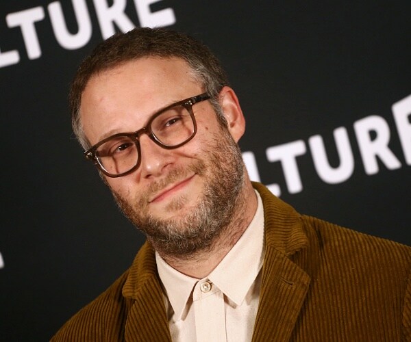seth rogen stand for photo
