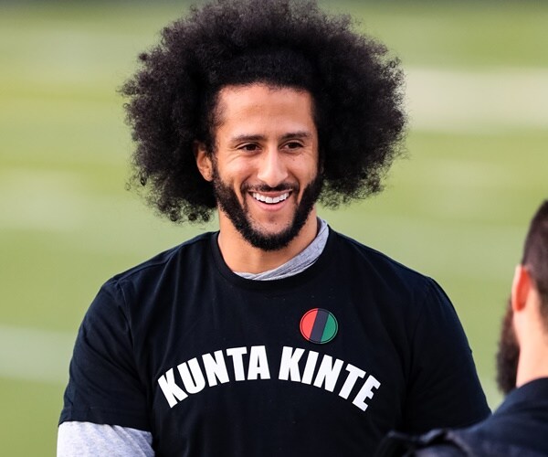 colin kaepernick smiles on the field
