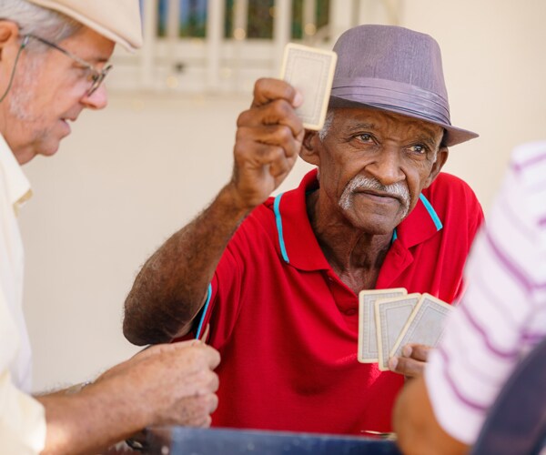 Senior citizens playing cards