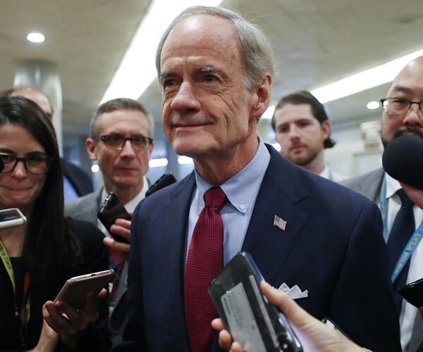 sen. tom carper speaks with reporters