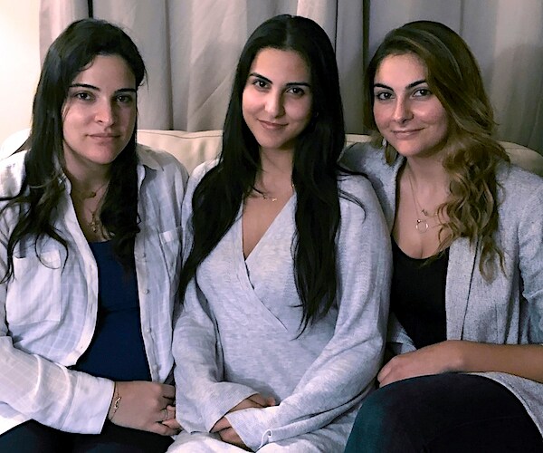 Guila, Macy, and Zoya Fakhoury, three of Amer Fakhoury's four daughters, gather in Salem, New Hampshire