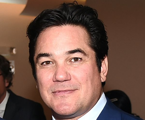 dean cain poses for a pararazzi photo