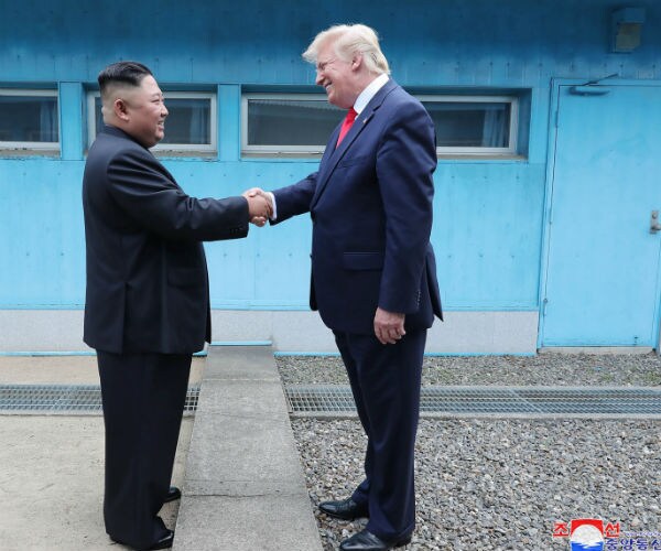 north korean leader kim jong un, left, and president donald trump shake hands