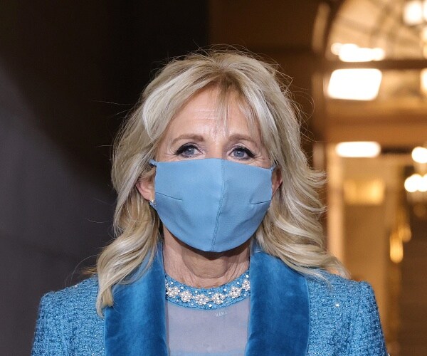 jill biden stands on steps