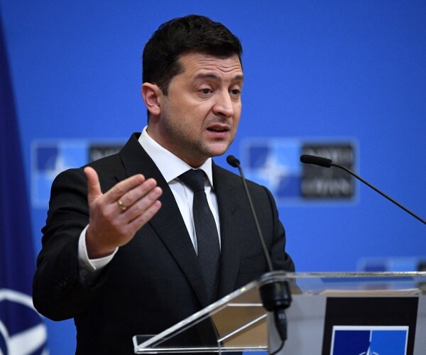 Volodymyr Zelensky talks during a press conference