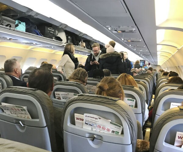 a crowded airplane is seen