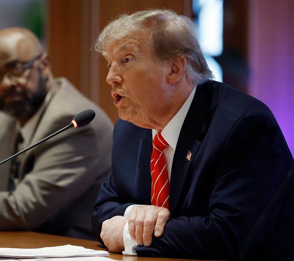 Donald Trump speaking into a microphone