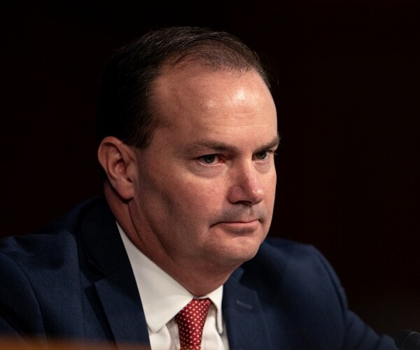 mike lee sits in hearing