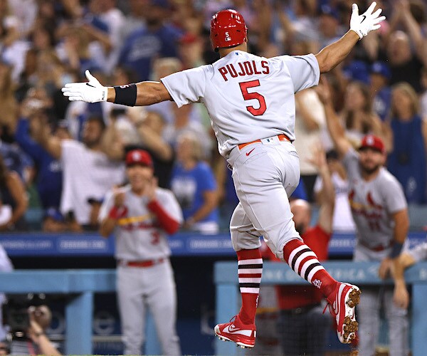 Albert Pujols celebrates his 700th career home run during the fourth inning at Dodger Stadium on Friday night
