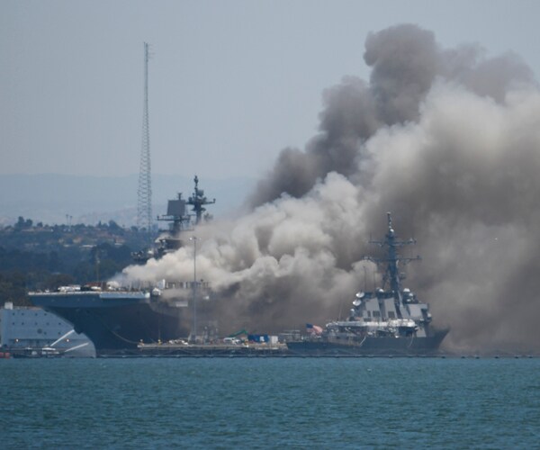 smoke rises from the uss bonhomme richard