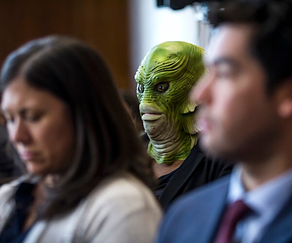 a swamp creature sits at the confirmation hearing of acting interior secretary david bernhardt.