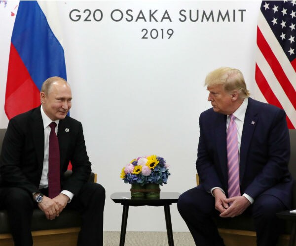 Putin and Trump in Japan last year for a summit 