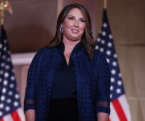 Ronna McDaniel stands on stage
