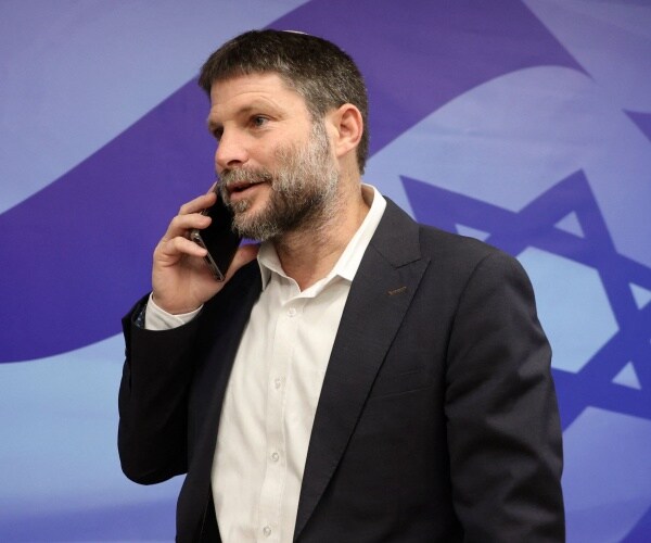 bezalel smotrich speaks on a cellphone