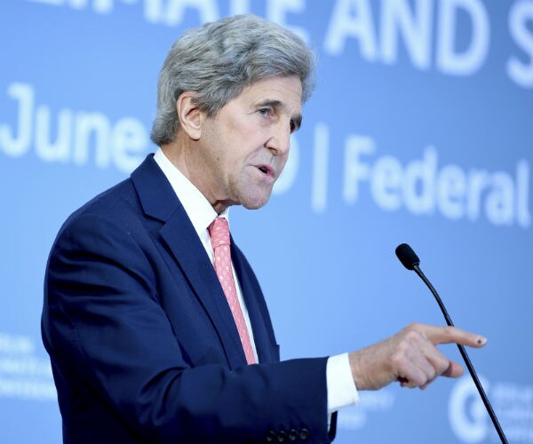 former us secretary of state john kerry is shown at a podium speaking