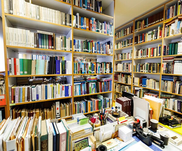 library books are displayed on shelves and tables
