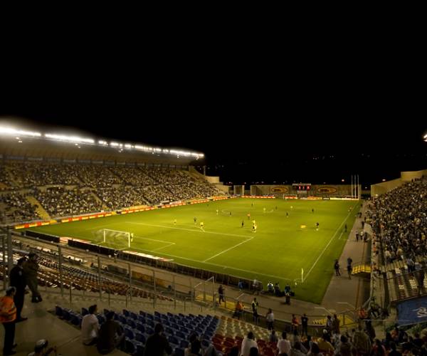 soccer players of the field during a night game