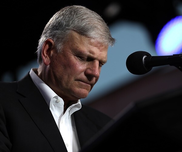 Rev. Franklin Graham praying