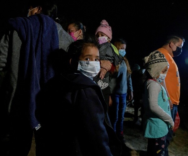 migrants cross river into us