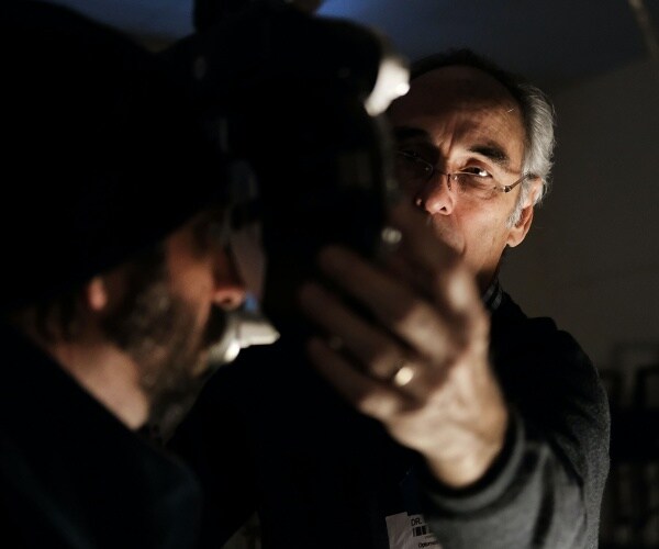 John Davis gives Tony Eldridge an eye exam at a vision clinic