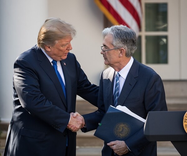 jerome powell and donald trump shaking hands