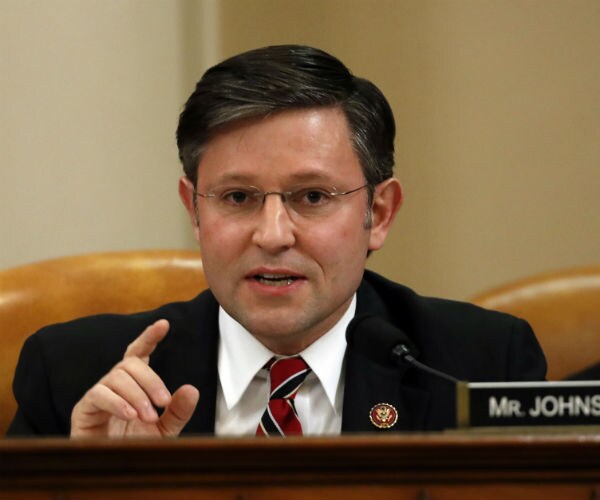 Rep. Mike Johnson, R-La., speaks during a House Judiciary Committee meeting wearing a tie, dress shirt and suit