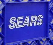 blue shopping cart, sears corporate logo in white on front