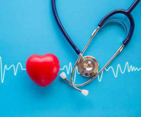 stethoscope and red heart with cardiogram