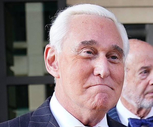 roger stone grimaces smugly while leaving court amid his trial