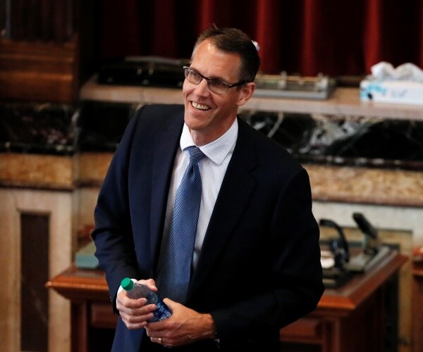 randy feestra holds water bottle