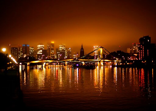 The Latest: European Central Bank to Dial Back Stimulus