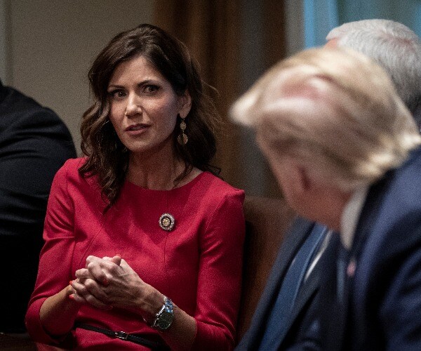 South Dakota Gov. Kristi Noem speaks to president donald trump