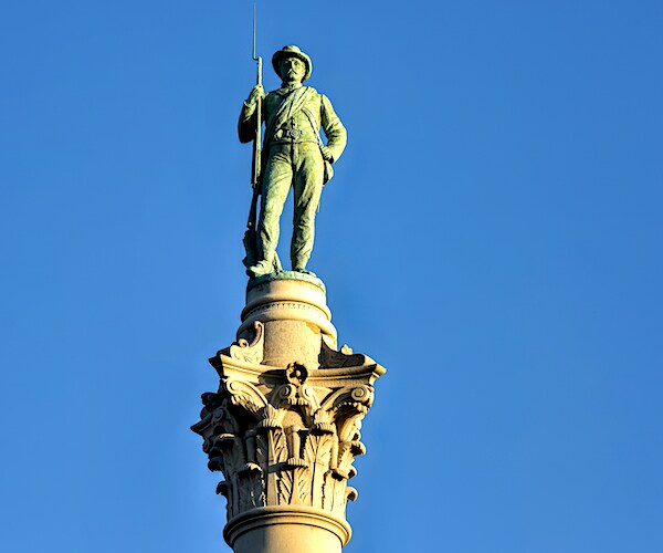 Confederate Soldiers & Sailors Monument depicts a bronze Confederate private standing on top of the pillar