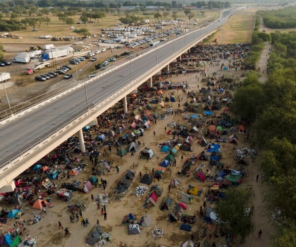 Migrants seen at an encampment along the Del Rio International Bridge 