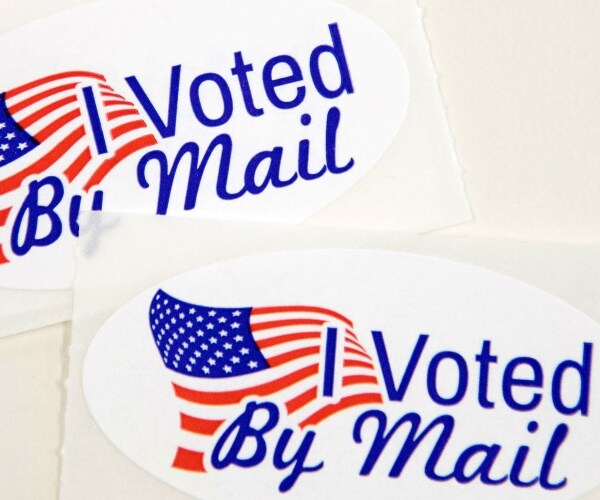 stickers saying "i voted by mail"