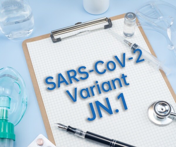 clipboard with COVID JN.1 subvariant typed on it, stethoscope, test, oxygen mask