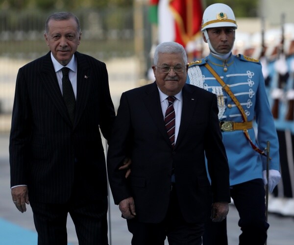 turkey's president and the palestinian president walk together
