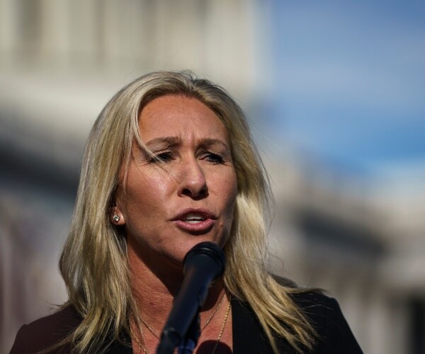 majorie taylor greene stands outside the capitol and speaks