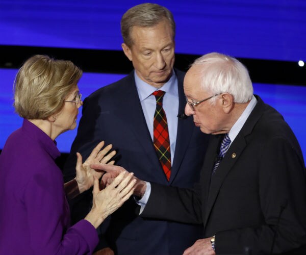 tom steyer in blue suit, stands in the middle of sen. elizabeth warren in purple and sen. bernie sanders 