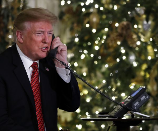 donald trump speaks with children from the north american aerospace defense command santa tracker.