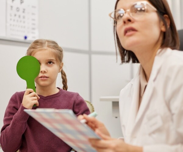 child undergoing vision test